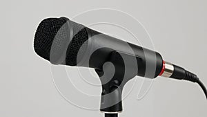Close-Up of a Modern Black Microphone on a Stand