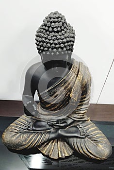 High-resolution closeup shot of a peaceful Buddha statue in a meditative pose