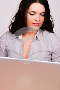 Beautiful young female using a laptop computer