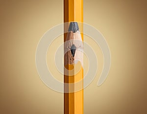 Sharp Yellow Pencil with Freshly Sharpened Tip on Smooth Surface