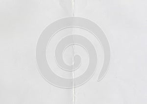 High resolution large image of white paper texture background scan folded in half, soft fine grain uncoated paper