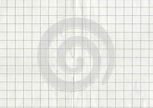 High resolution large image of a white uncoated checkered graph paper scan wrinkled weathered old thin textbook paper with gray