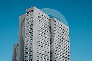 High rise apartment building on blue sky