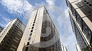 High rise apartment building complex with blue sky