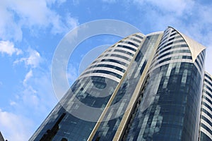 High-rise building on a background cloudy sky