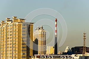 High rise building and Smokestack with Iron tower