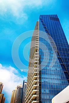 High-rise buildings against the blue sky. Bottom view