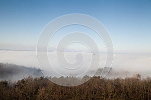 High rise buildings in the fog with blue sky