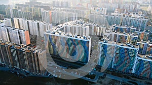 High rise buildings in new modern residential area, aerial view. Journey. Flying above the new colorful houses, concrete