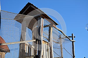 High-rise children`s house with bridges and footbridges for better safety, the whole game element is networked with a rope net. ch