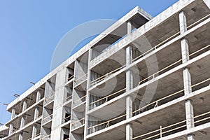 high-rise building under construction against blue clean sky background