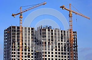 High-rise construction cranes and array of buildings under construction