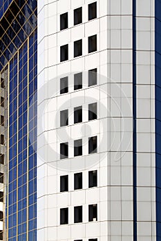 High-rise multi-storey, apartment building close-up in gray.