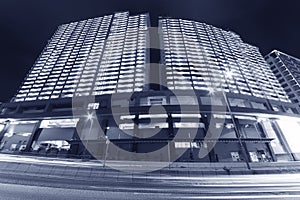 High rise residential building in downtown of Hong Kong city at night