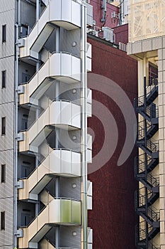 high-rise residential building with external stairs in Tokyo, Japan