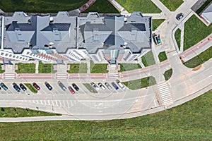 High-rise residential building with outdoor parking lot. aerial top view