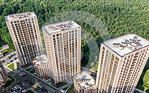 High-rise residential buildings near the green park. sunny summer day. drone photo