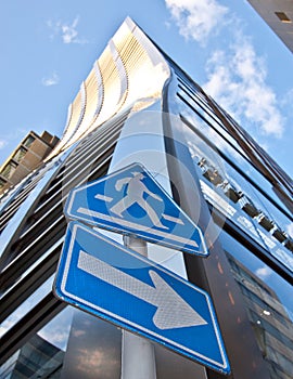 High rise tower and cross walk sign