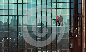 High-rise workers wash the facade and glass of a skyscraper