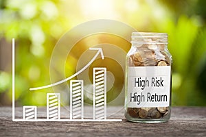 High risk high return Word With Coin In Glass Jar and graph up. Financial Concept