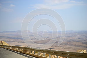 High road at bottom of Makhtesh Ramon Crater, Mitzpe Ramon, Negev desert, Israel