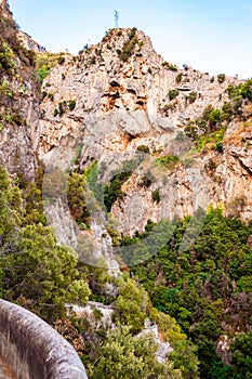 High rocky mountains above Fiordo Di Furore natural gorge with Tyrrhenian sea bay in Campania region