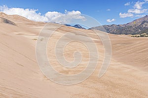 High sand dunes and the Rocky Mountains