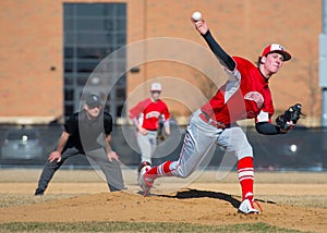 High School Baseball pitcher throws a pitch