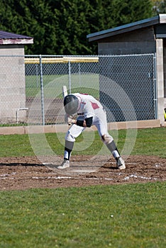 A high school baseball player up to bat.