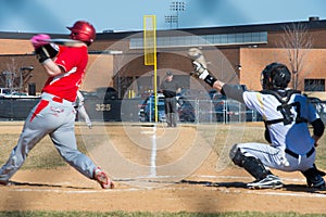 High school baseball umpire watches the batter and catcher