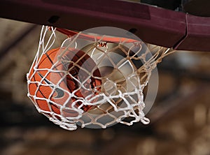 Basketball Going Through A Basketball Hoop.