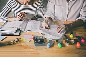 High school or college Asian student group sitting at desk in cl