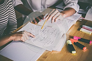 High school or college student group catching up workbook and le photo