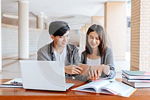 High school or college students  group catching up workbook and learning tutoring on desk and reading, doing homework, lesson