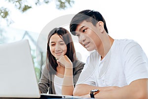 High school or college students group catching up workbook and learning tutoring on desk and reading  doing homework  lesson