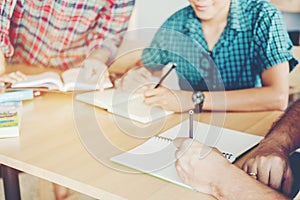 High school or college students studying and reading together in