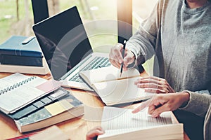 High school or college students studying and reading together in