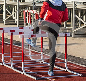 Female hurdler warming up before her race