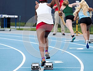 High School Girls Sprint relay race start