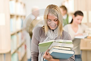 High school library - happy student with book