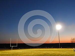 High School referee in empty football field during Covid Pandemic game