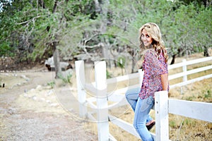 High School Senior Sitting on Fence