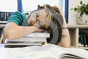 High School Student Sleeping in Library