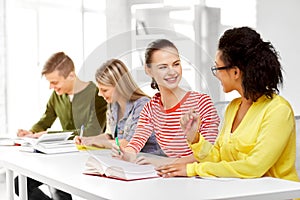 High school students with books and notebooks