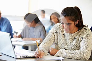 High School Students In Class Using Laptops