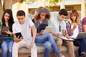 High School Students Collaborating On Project On Campus