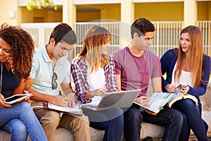 High School Students Collaborating On Project On Campus