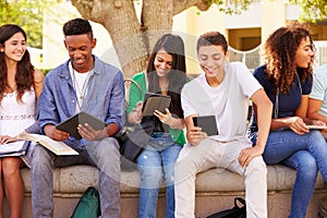 High School Students Collaborating On Project On Campus