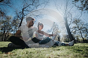 High school students collaborating on a project outdoors on a sunny campus