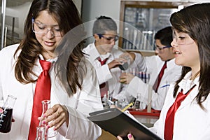 High School Students Conducting Experiment